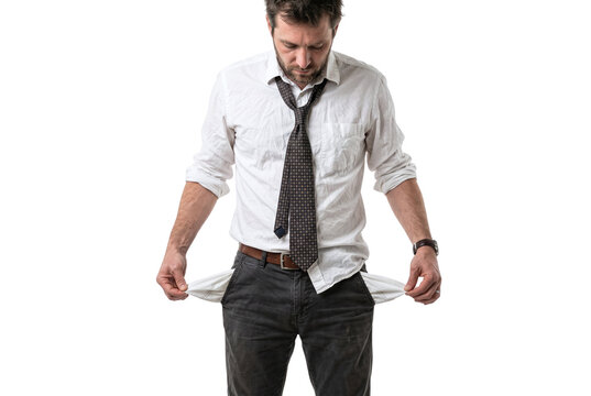 Disheveled businessman showing his empty pockets looking down