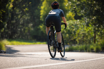 Naklejka premium People cycling on the greenway