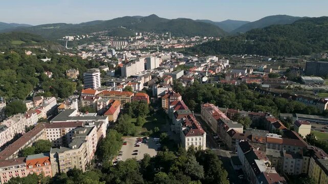 Aerial drone panorama of &Uacute;st&iacute; nad Labem under an overcast spring sky, showcasing the city town with its urban architecture, green city parks, and the Elbe River