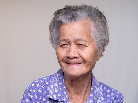 Senior woman smiling without dentures in healthcare portrait