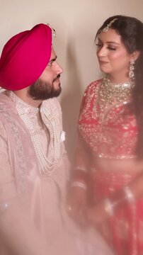 Vertical Mid Shot of Romantic Sikh Indian Bride And Groom at Wedding Day