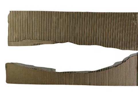 Ancient wooden comb with intricate carved teeth