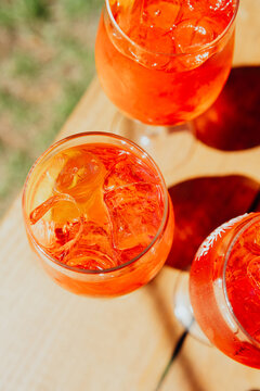 Orange drinks with ice in glasses on a table