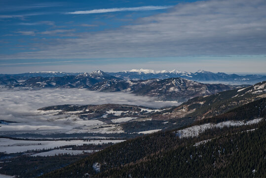 Mala Fatra and Velky Choc from hiking trail above Ziarska dolina valley in Western Tatras mountains in Slovakia during winter