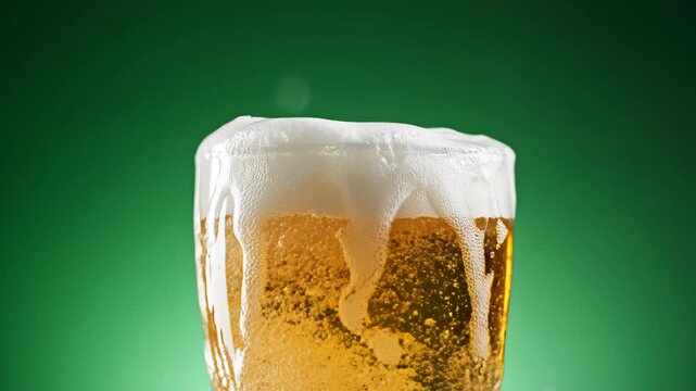 Beer pouring into glass with splash