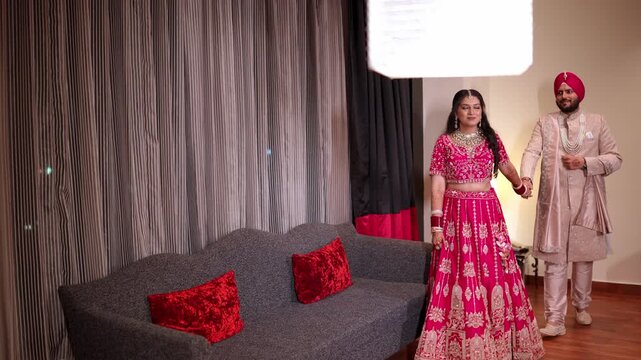 Wide Shot of Romantic Indian Bride and Groom Walking While Holding Hands at Wedding Day