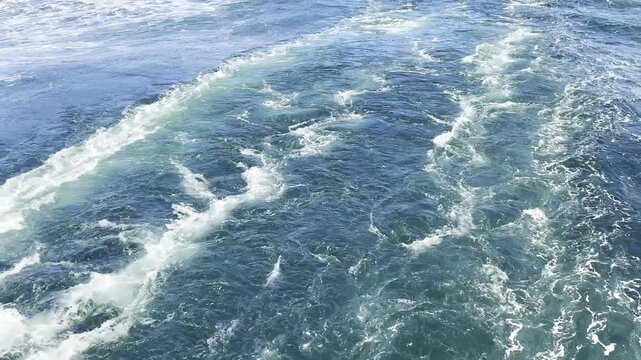 ocean surface a stern of the bug ship. keel jet. vessel propeller run and mix, turn the water. unstoppable, background video.