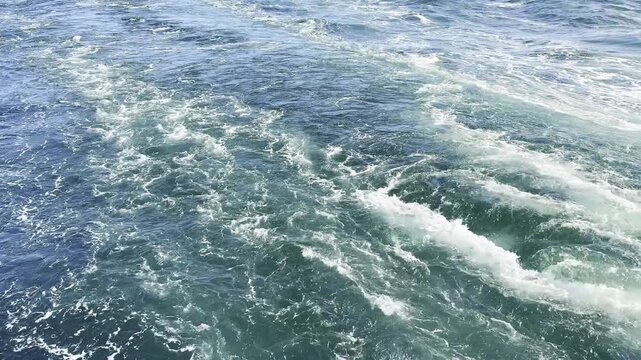 unstoppable, background video. ship propeller run, mix ocean water and make keel jet, stream or burned water