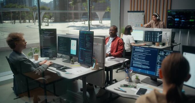 Multiethnic Software Engineers Build an Ai Powered Banking App in a Bright Glass Office, a White Male Developer Types Backend Code While a Black Male Lead Plans Cybersecurity Architecture on Screens.