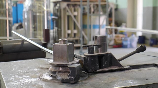 Industrial bender equipment machine for metal pipe in factory. Automatic metalworking machine for electronic turning metal pipe and bending at industrial manufacturing plant. mettalurgical work. 4 k