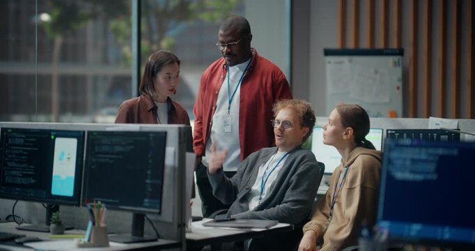 Using Computer. Multiethnic Group of Software Engineers Meeting Gather around Computer to Analyse App Code Shown on Screens in Office: Asian Woman, Black Man, Colleagues Brainstorm UI Design, AI