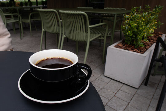 a cup of filter coffee on a table in a cafe