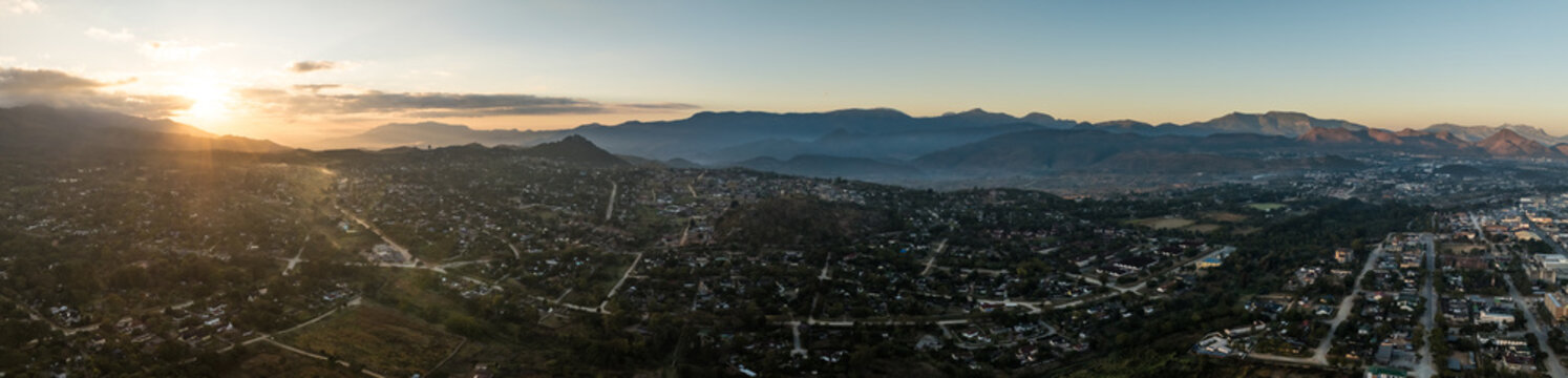 Aerial view of Mutare city at sunset with mountains
