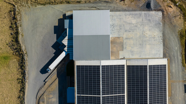 Aerial view of industrial facility with solar panels