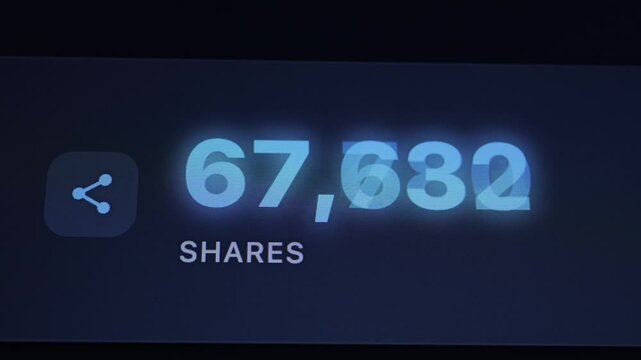 Close-up of a screen showing a high count of shares.