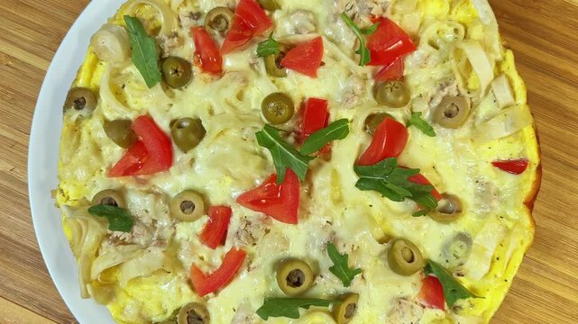 Pizza on chopped thin flat bread base with eggs