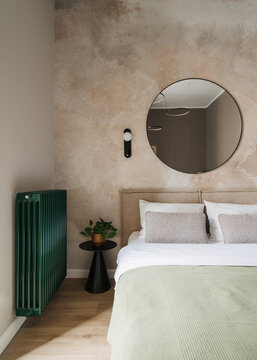 Modern hotel bedroom with comfortable bed and stylish decor in a cozy setting