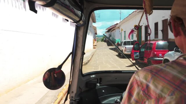 Travelling aboard a tuk tuk through the colonial town of Barichara Santander