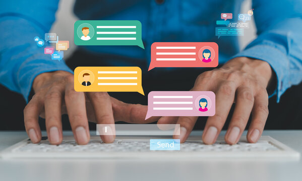 Hands typing on laptop keyboard with floating chat bubble icons, Online chat communication, social media engagement, live chat support, digital marketing, customer service and internet networking