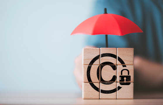 Copyright protection concept with umbrella covering copyright symbol and security lock. Symbolize intellectual property rights, legal protection, copyright compliance, licensing and content security.