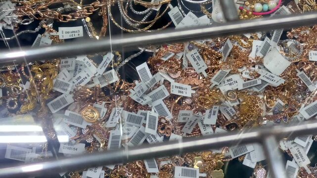 Gold jewelry display in a showcase at the store