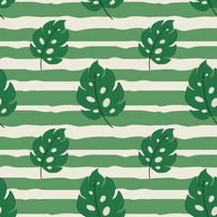 Green monstera leaf seamless pattern. Vector hand drawn tropical foliage pattern. Summer botanical leaf beach design on green and cream striped background for packaging, fabric, textile. © DesignToonsy
