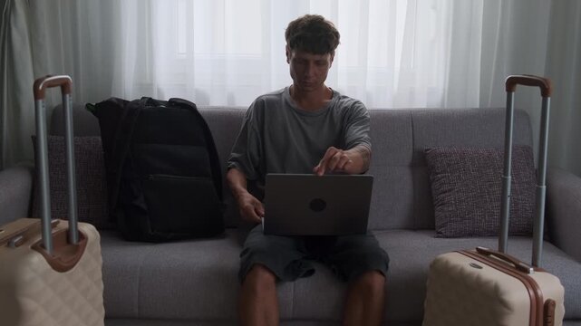 Modern transient lifestyle and temporary living. Man working and moving between rented apartments with constant relocation
