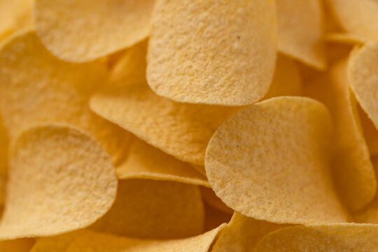 Close-up of crunchy potato chip with blurred background