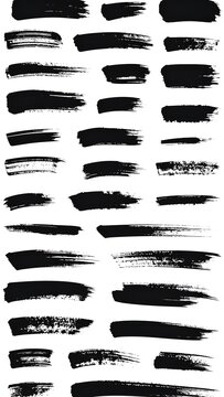 Collection of black ink brush stroke marks on white background for artistic design