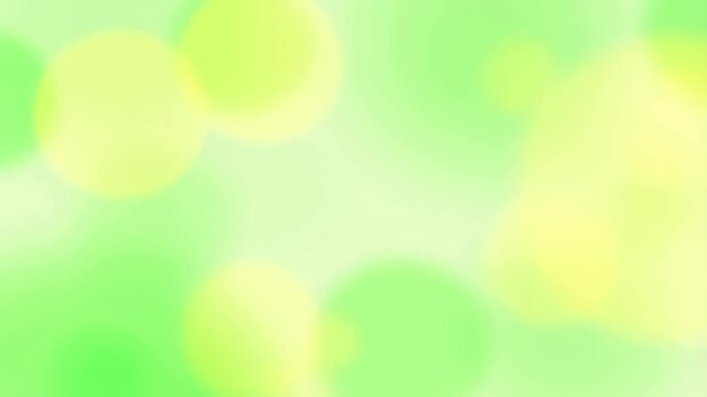 Soft green and yellow bokeh background with a dreamy atmosphere. Ideal for creating a calming and serene visual experience in various projects