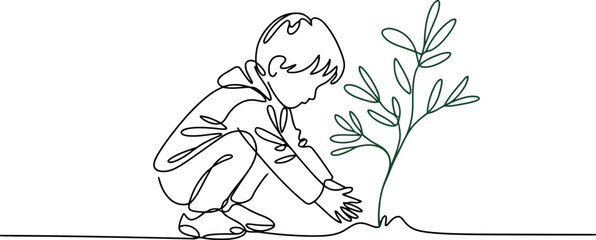 Fototapeta premium Child in hooded jacket crouching to plant a small green sapling with leaves on white background