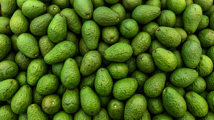 Naklejka premium Fresh Green Avocados Pile Healthy Organic Fruit Food Background