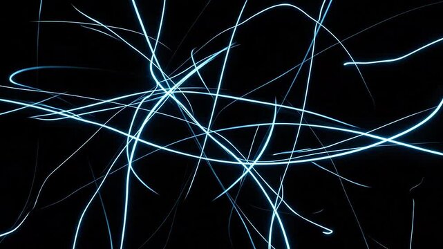 Abstract blue light trails moving across a dark black background