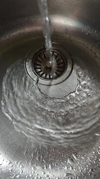 Water flowing in the steel sink