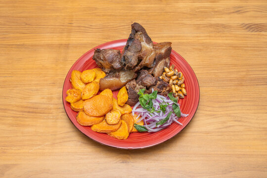 Crispy Peruvian torrezno, made with pork skin fried to a golden, bubbling texture, served with toasted cancha serrana