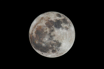 Fototapeta premium full moon with multicolored crater surface in black sky