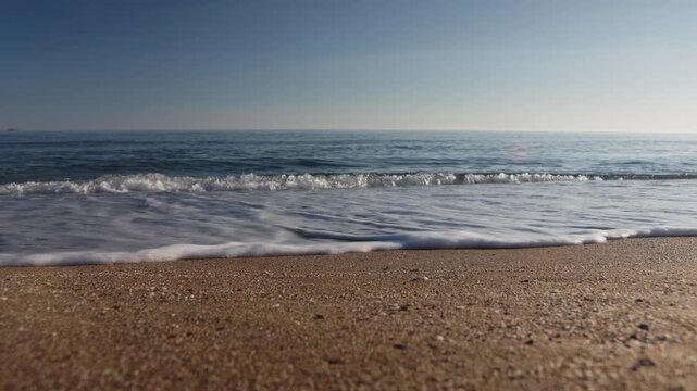 Static wide angle shot of the calm open Mediterranean sea and clear blue sky horizon line in Kato Gouves, Crete, Greece. Minimalist summer vacation background