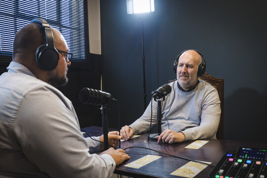 Two Men Recording a Podcast in a Professional Studio