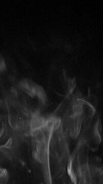 Vertical view of white natural steam or smoke rising across the entire width of the screen, as if from fire or conflagration