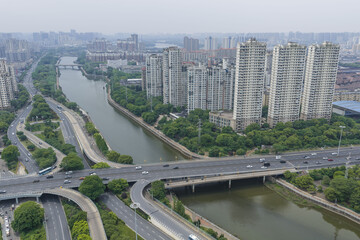Aerial view of residential towers, highways and canal in Nanchang, Jiangxi, China © TrieuHao