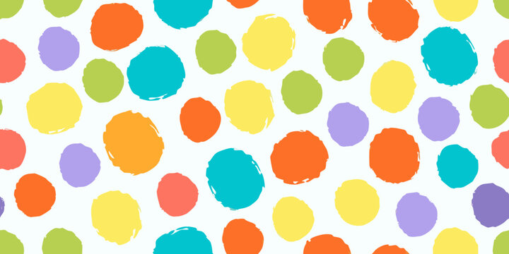 Colorful confetti dot pattern on a white background