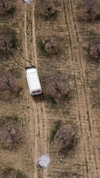 Drone image of moving vehicle in the garden