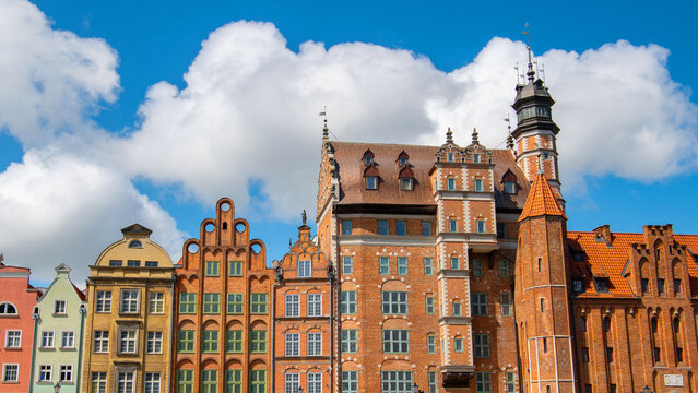 Hanseatic style brick facades and famous Naturalists House tower in Gdansk.