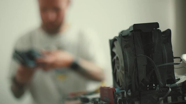 Technician repairing computer cpu cooler fan