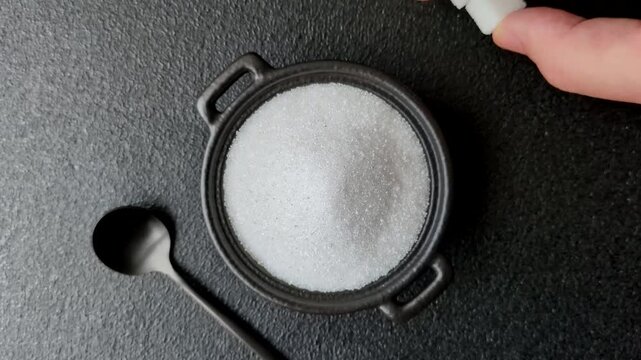 Sweet white sugar as a source of glucose. White sugar as a food background for your design