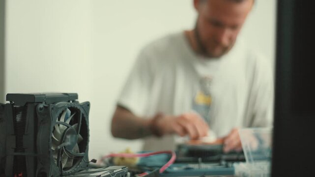 Computer technician assembling cryptocurrency mining rig