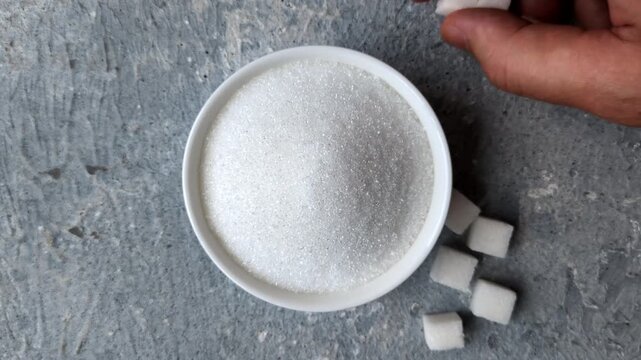 The sugar ban sign as a concept to stop the problem of diabetes and obesity, a call to diet. The sugar ban sign as a background for your design