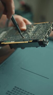 Repairing a circuit board in a workshop in the afternoon