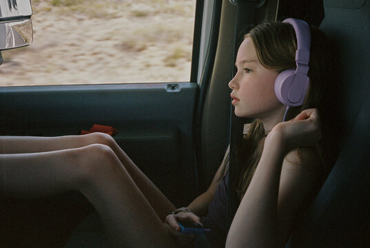 Young Girl portrait family travel in RV listen to Music  film 
