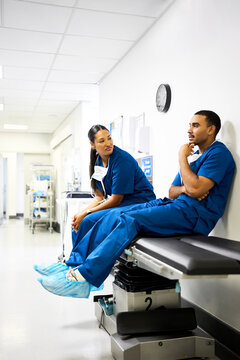 Doctors Take a Break in Hospital Corridor
